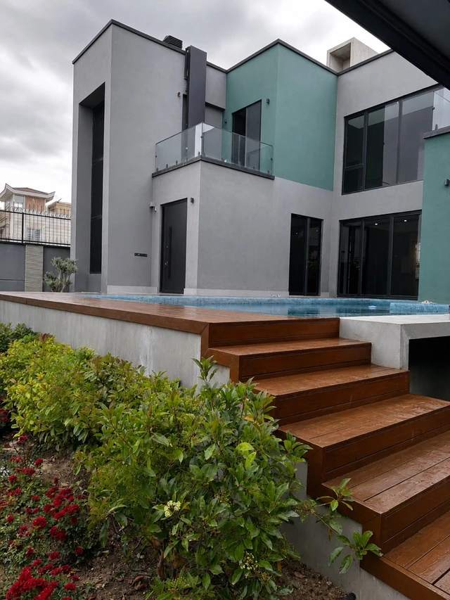 Afshariye Villa pool terrace with timber steps and glass balconies